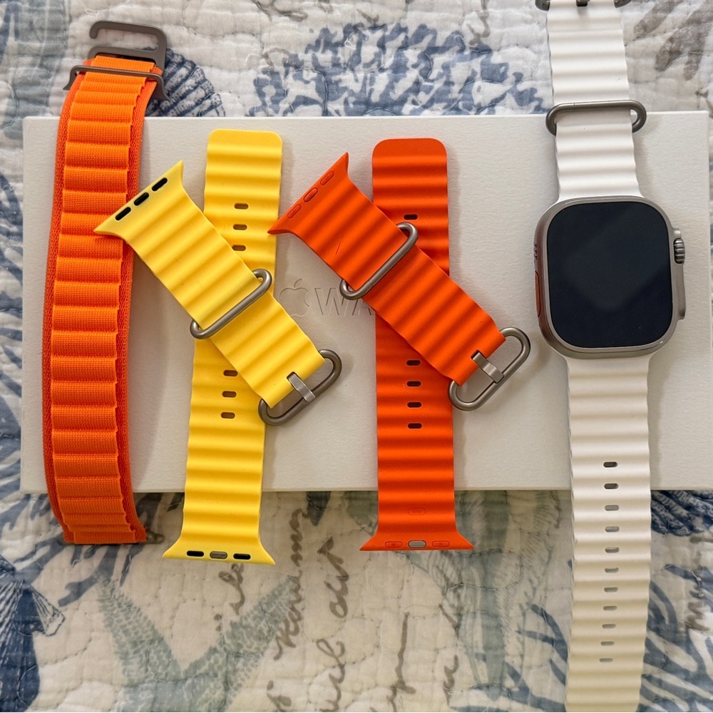 Apple Watch Ultra 1st Gen Smartwatch with White, Orange, and Yellow Bands